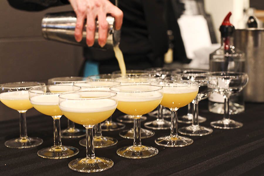Cocktails being poured at a party.